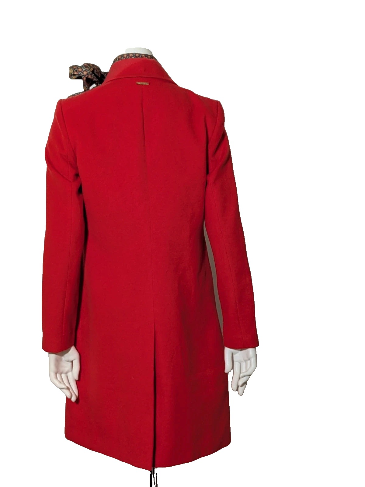 Studio F red coat with black button closure and gold logo tag on collar.