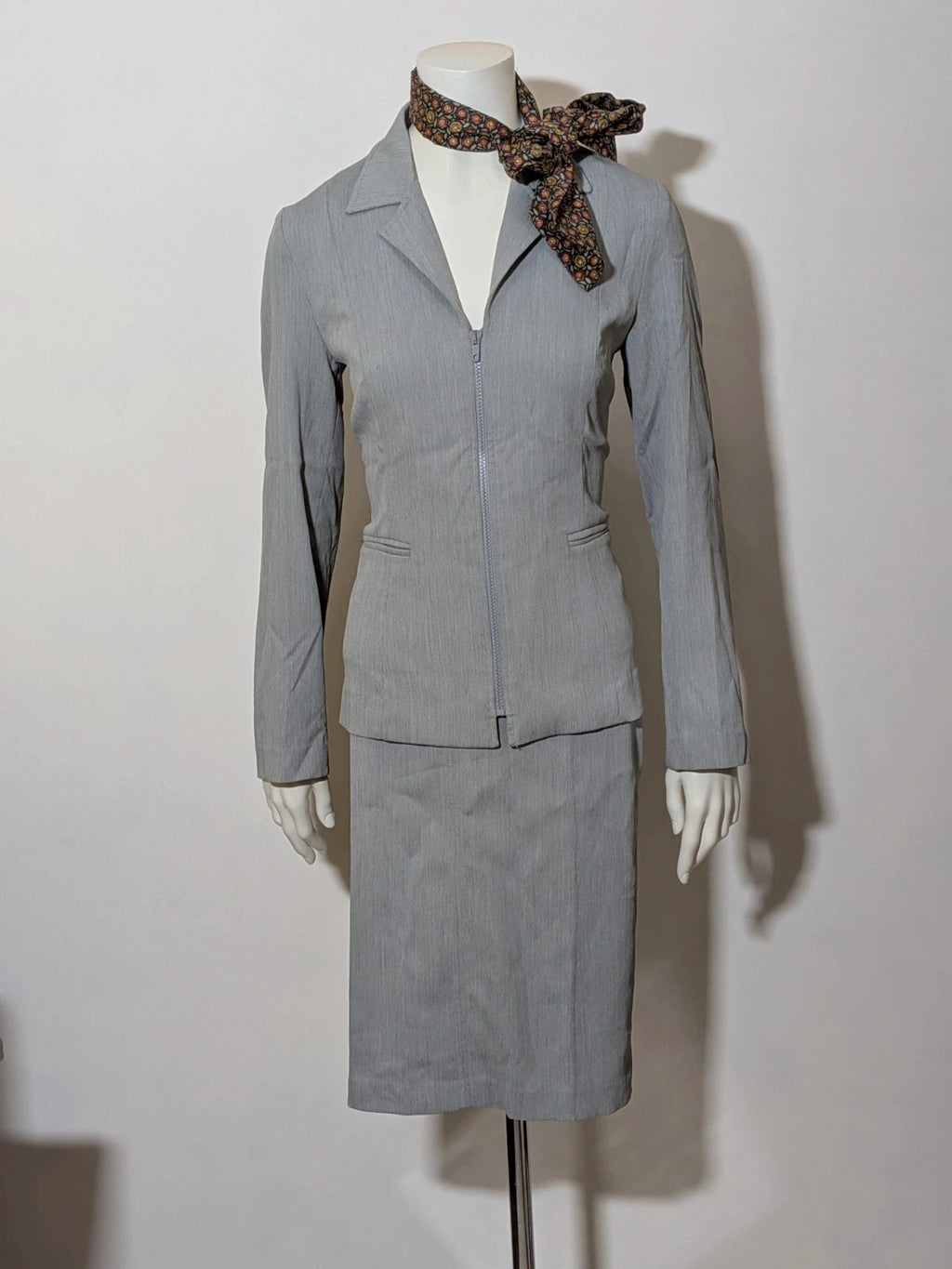 M-Made in Italy grey skirt suit with zip jacket, classic lapel, pencil skirt design.