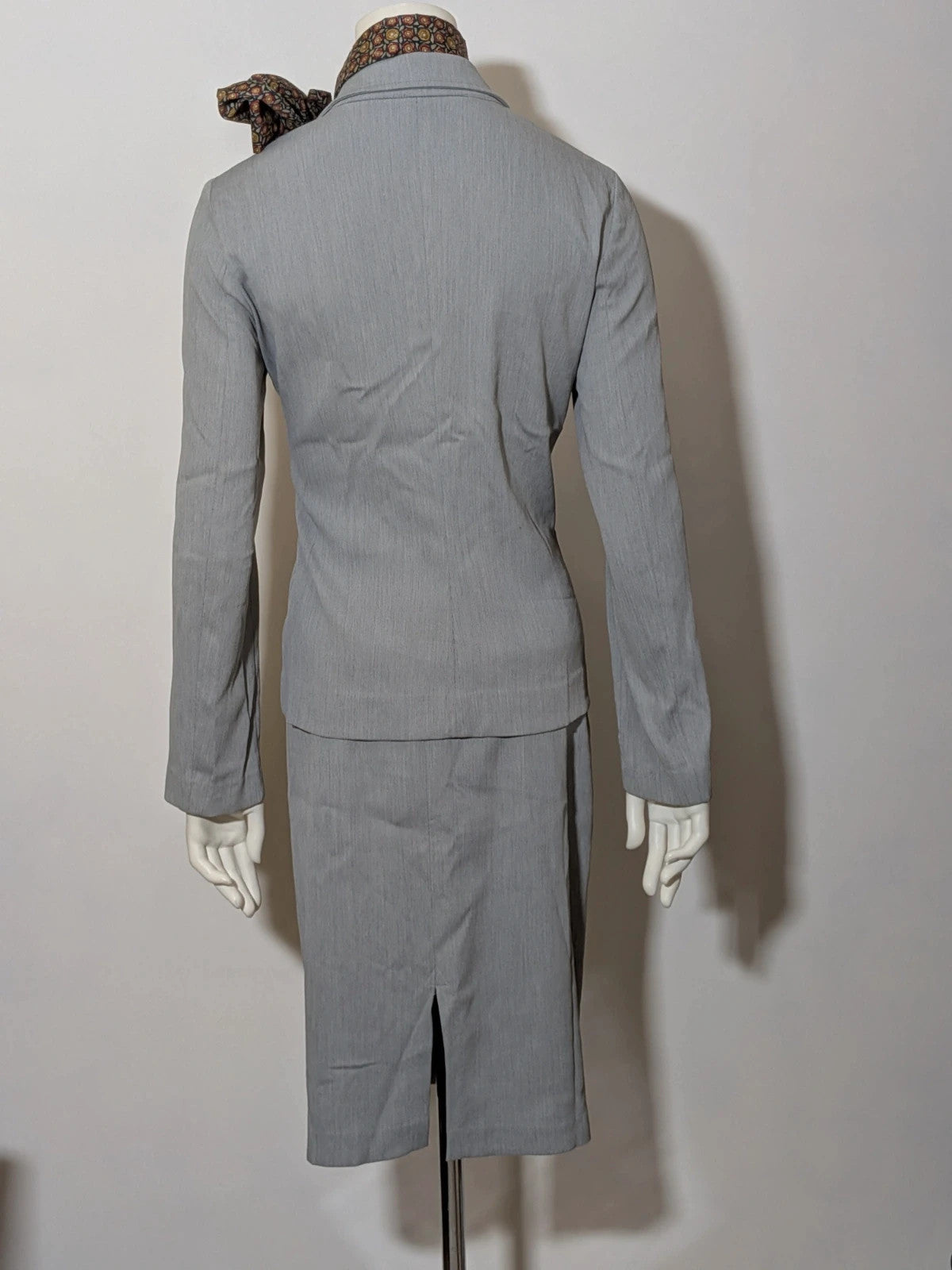 M-Made in Italy grey skirt suit with zip jacket, classic lapel, pencil skirt design.