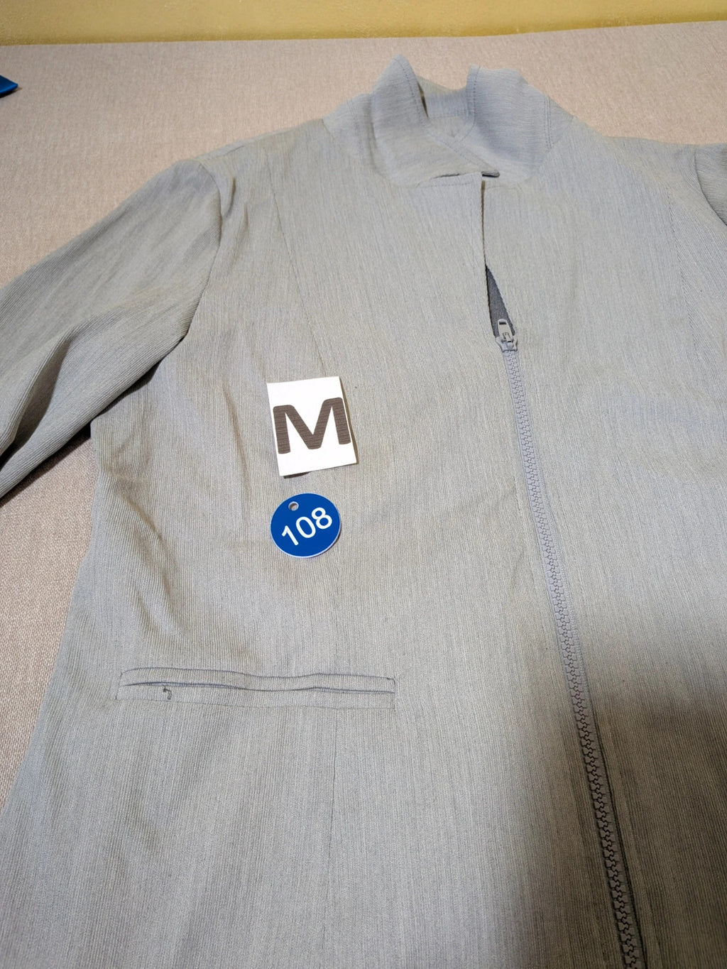 M-Made in Italy grey skirt suit with zip jacket, classic lapel, pencil skirt design.