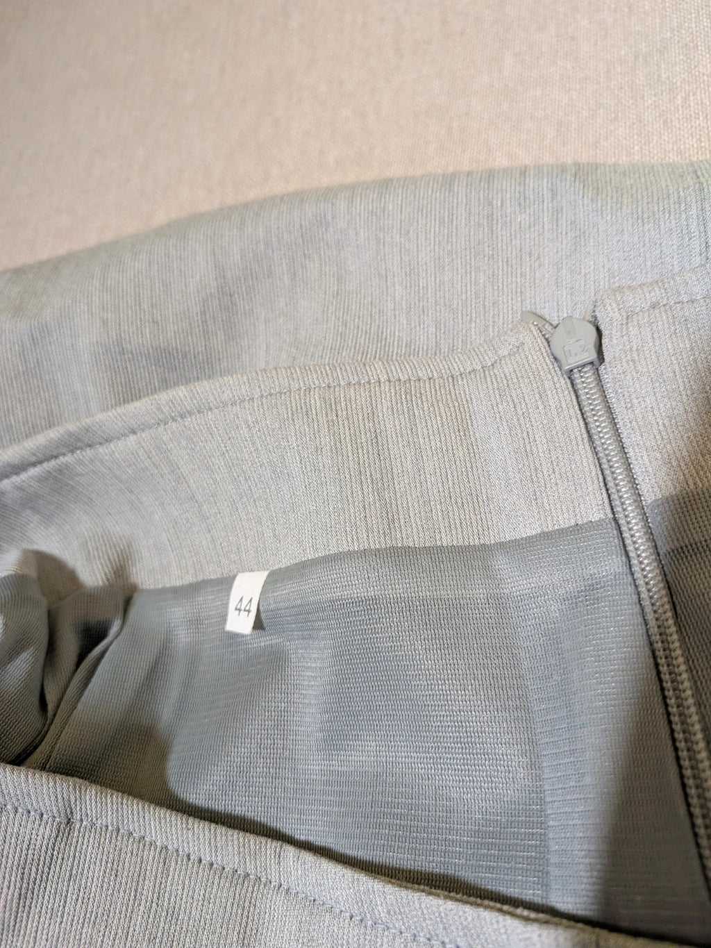 M-Made in Italy grey skirt suit with zip jacket, classic lapel, pencil skirt design.