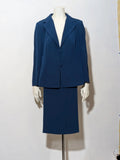 Romy blue skirt suit with classic blazer, two-button closure, and pencil skirt.