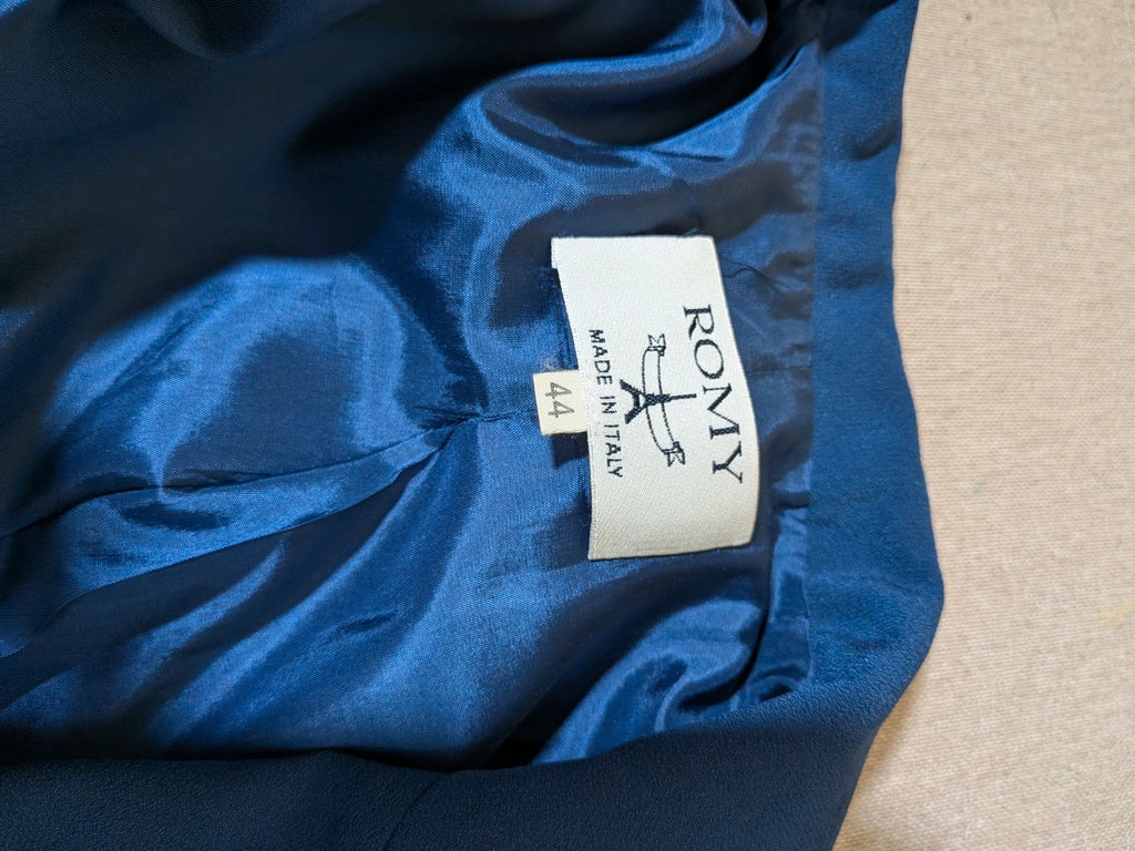 Romy blue skirt suit with classic blazer, two-button closure, and pencil skirt.