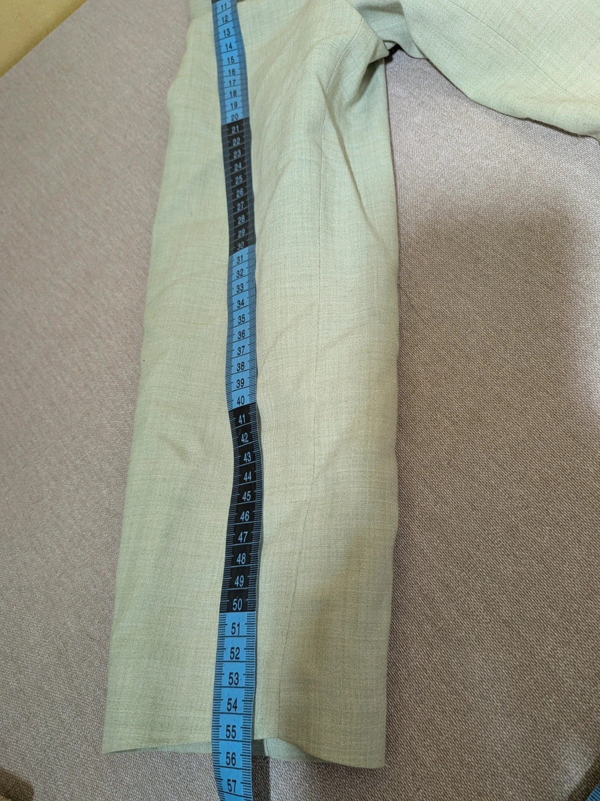 M-Made in Italy green blazer collarless design with three-button closure and front pockets.