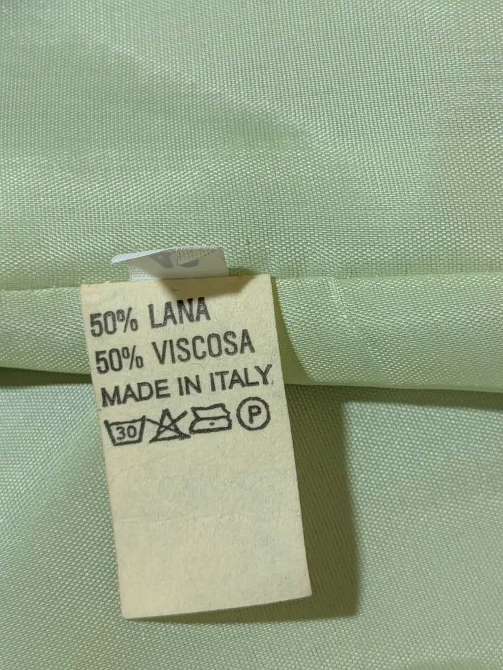 M-Made in Italy green blazer collarless design with three-button closure and front pockets.