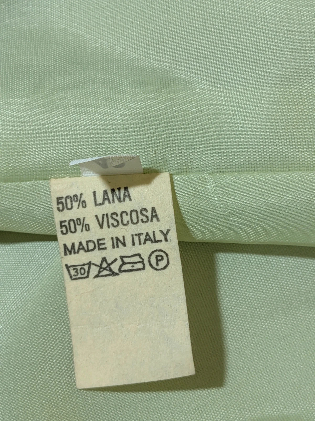 M-Made in Italy green blazer collarless design with three-button closure and front pockets.