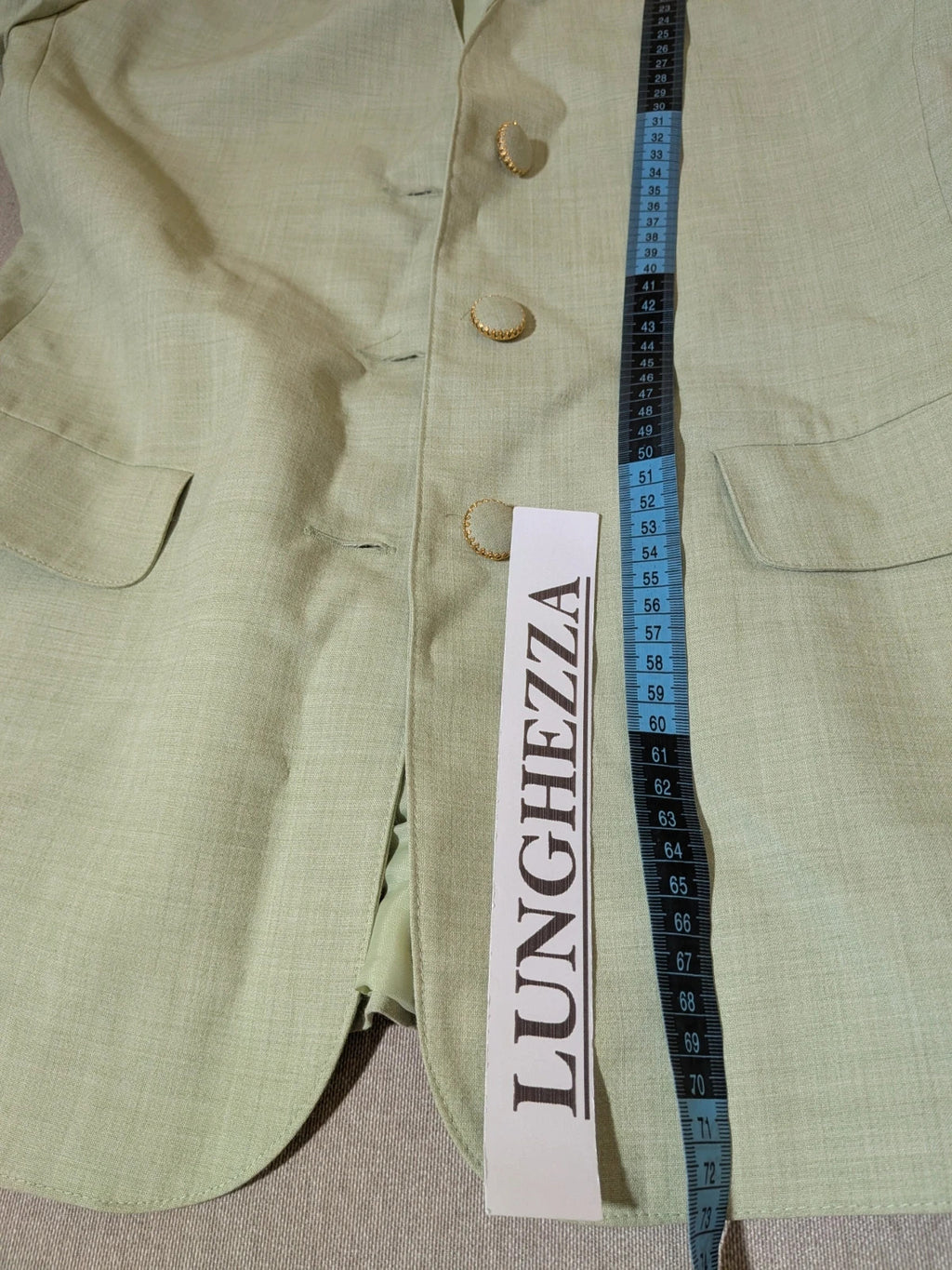 M-Made in Italy green blazer collarless design with three-button closure and front pockets.