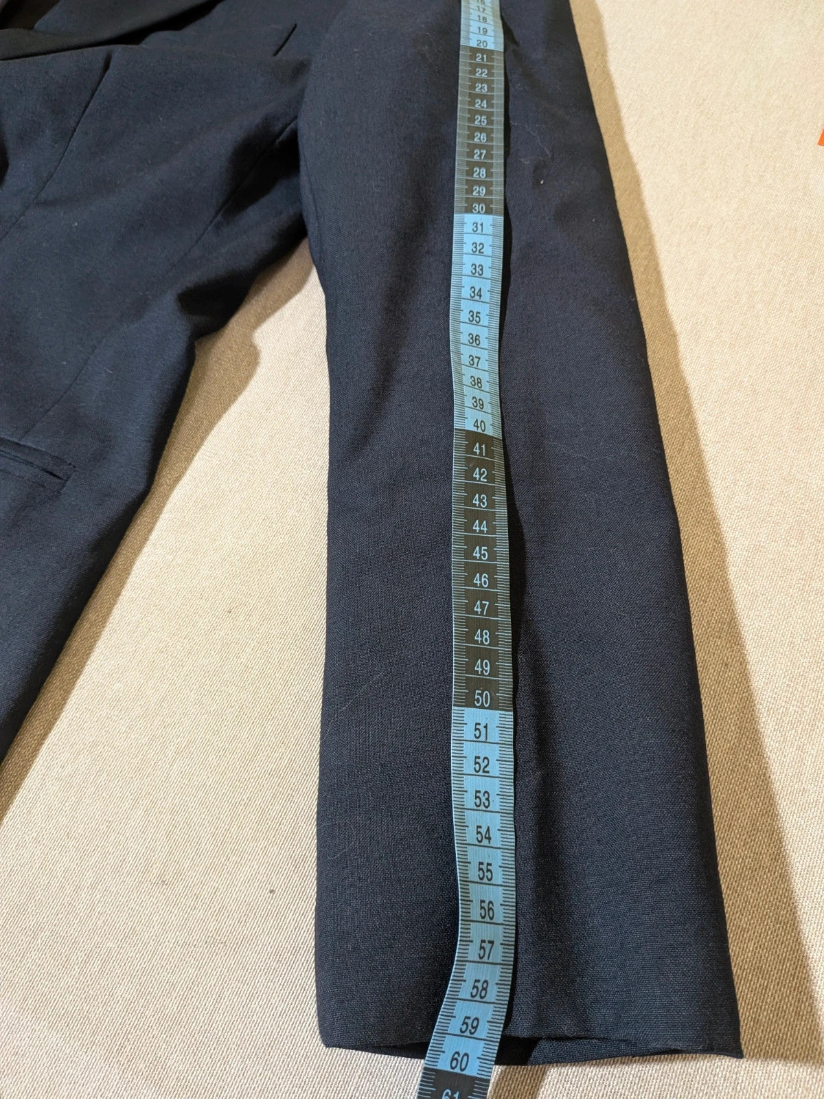 Made in Italy navy blazer suit with structured design and Pura Lana Vergine quality label.