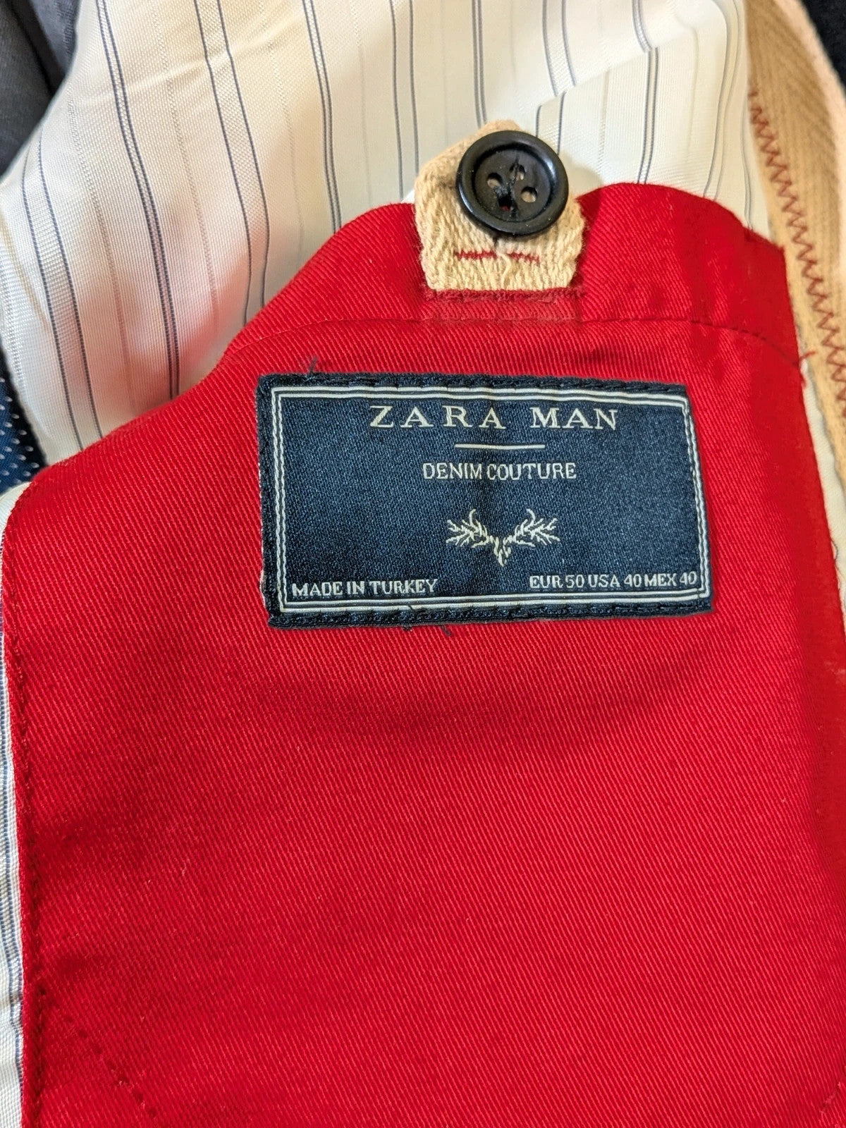 Zara Man navy blazer double-breasted with gold nautical buttons and striped lining.