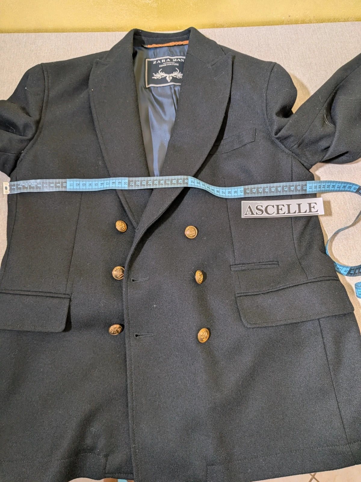 Zara Man navy blazer double-breasted with gold nautical buttons and striped lining.