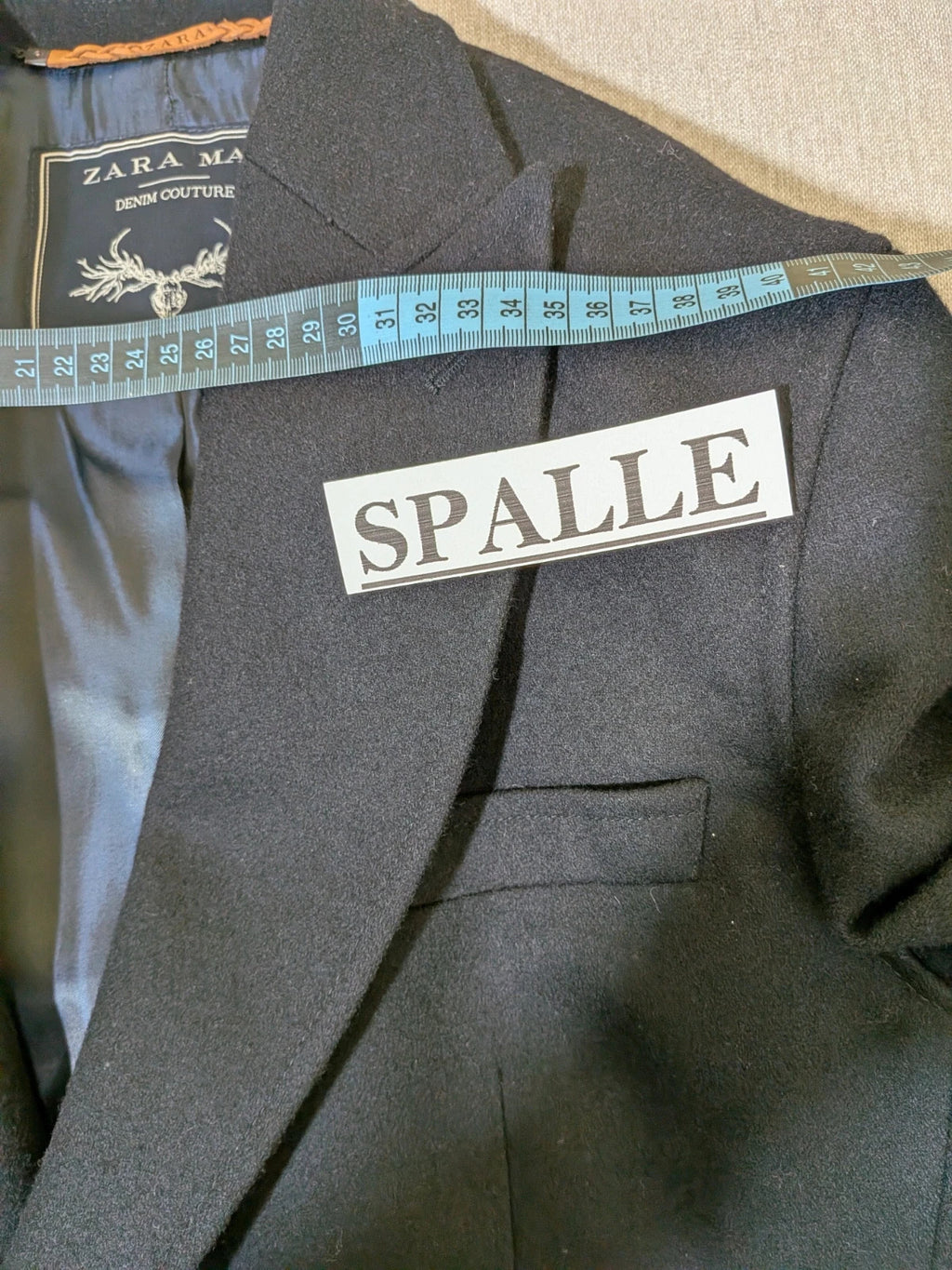 Zara Man navy blazer double-breasted with gold nautical buttons and striped lining.