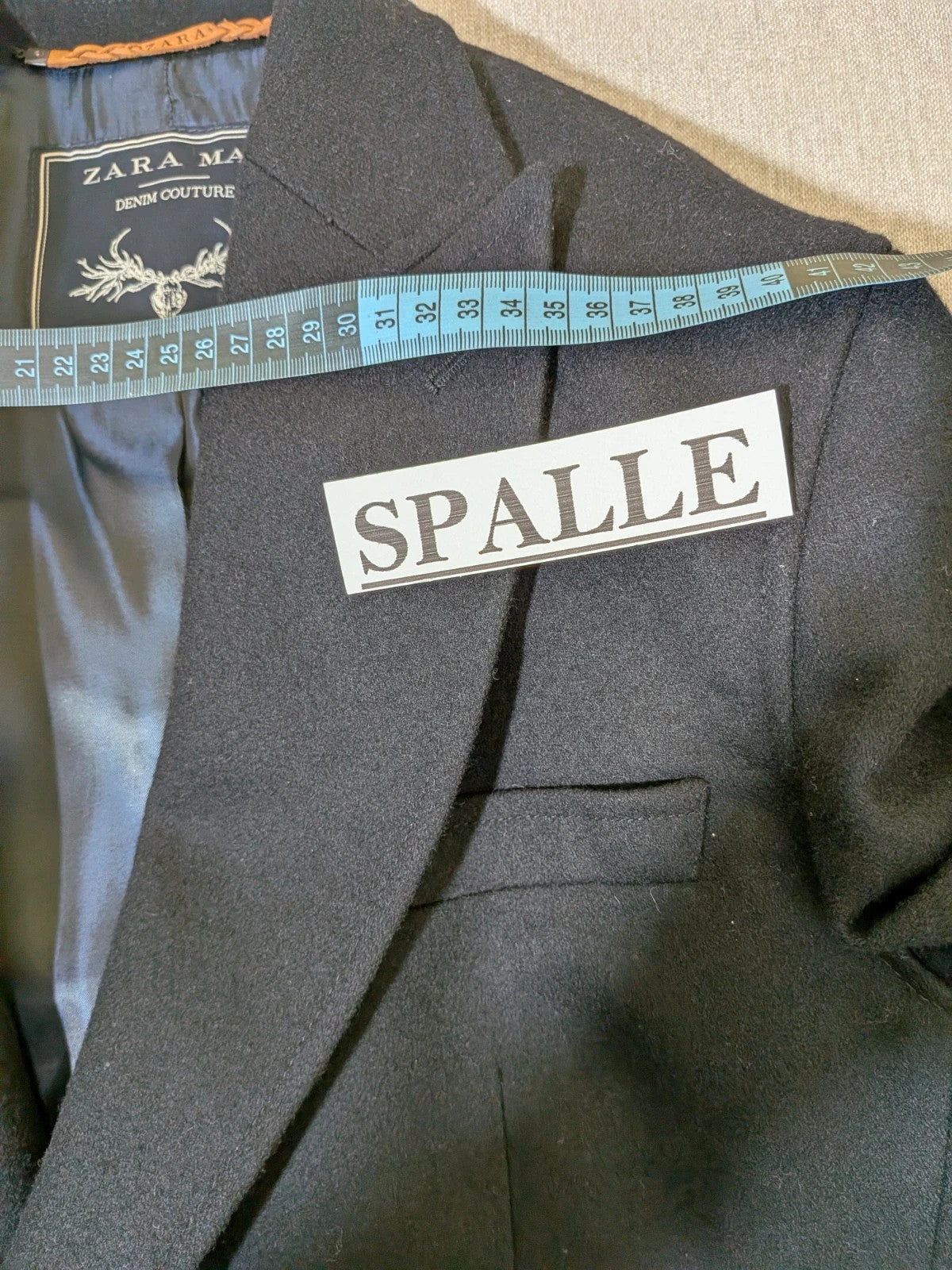 Zara Man navy blazer double-breasted with gold nautical buttons and striped lining.