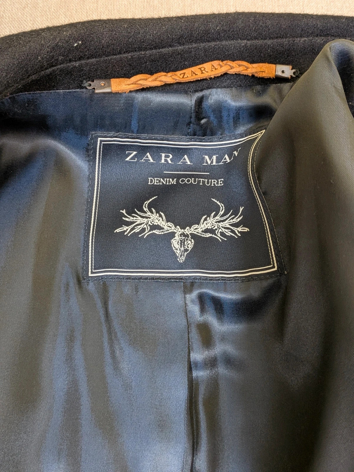 Zara Man navy blazer double-breasted with gold nautical buttons and striped lining.