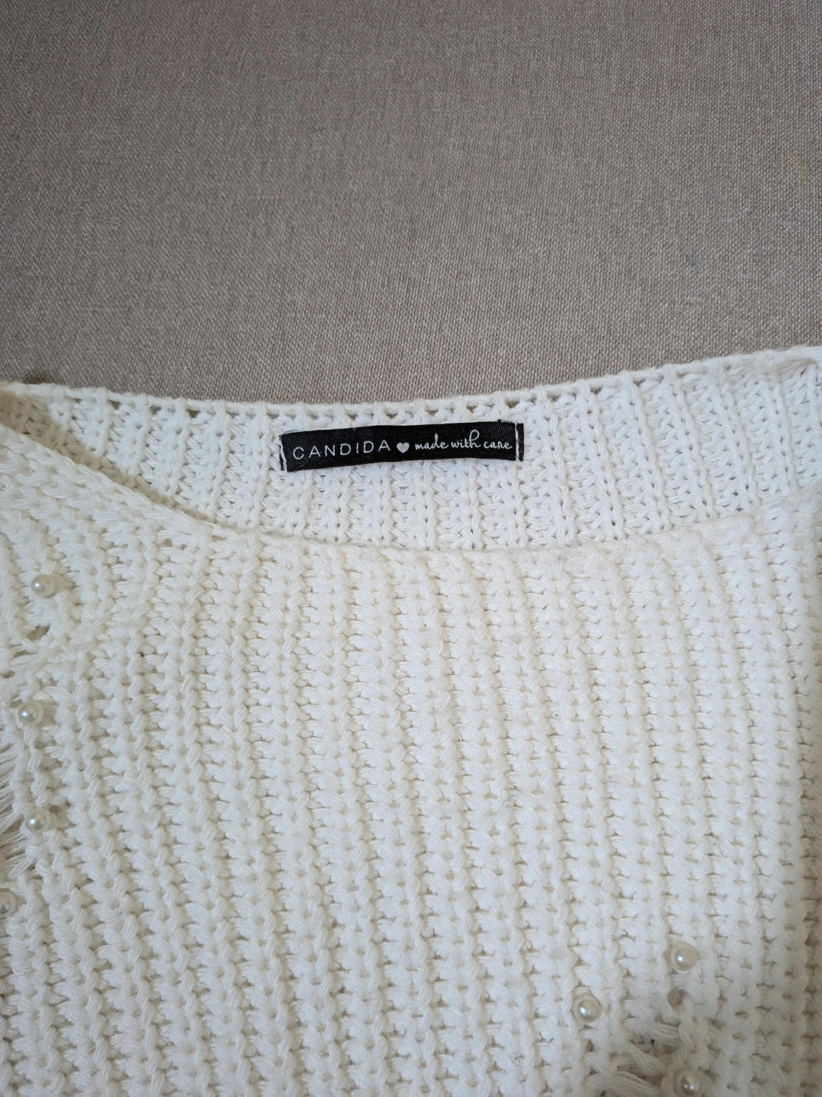 Cycle multi suit with tweed shorts and cream cropped sweater featuring distressed knit details.