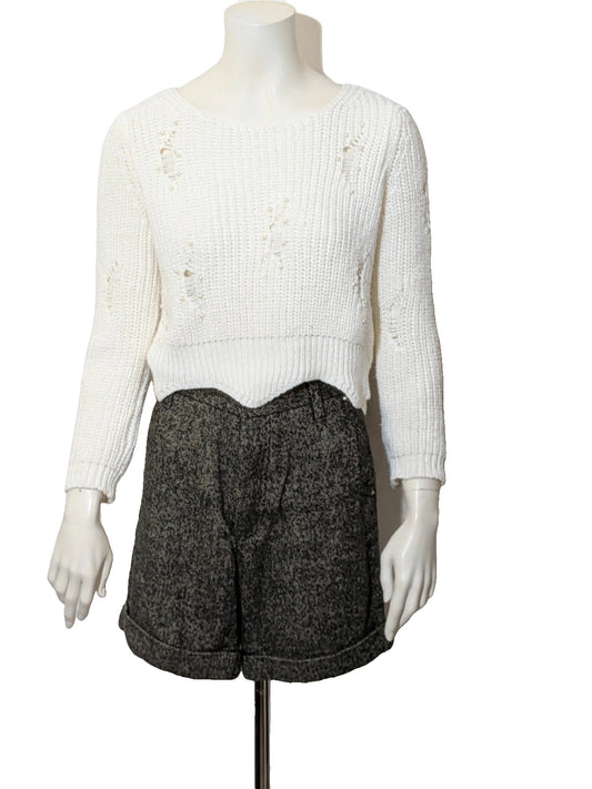 Cycle multi suit with tweed shorts and cream cropped sweater featuring distressed knit details.