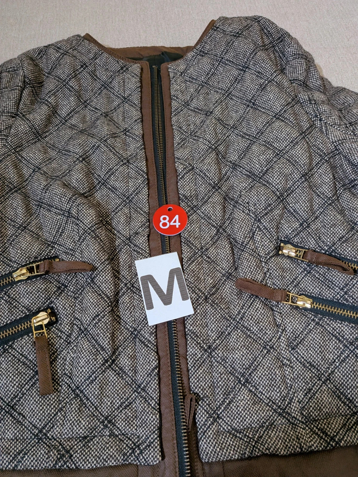 Zara Basic beige and brown quilted jacket with geometric pattern and suede trim.
