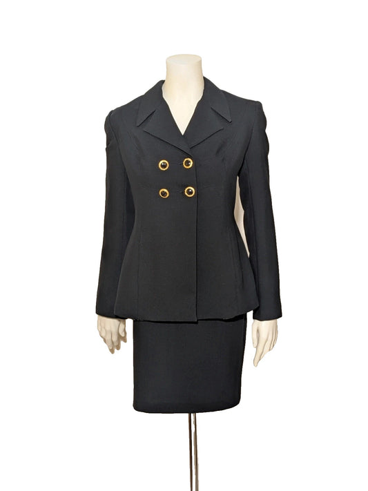 Puerto Plata black skirt suit with gold and black jewel buttons, structured fabric.