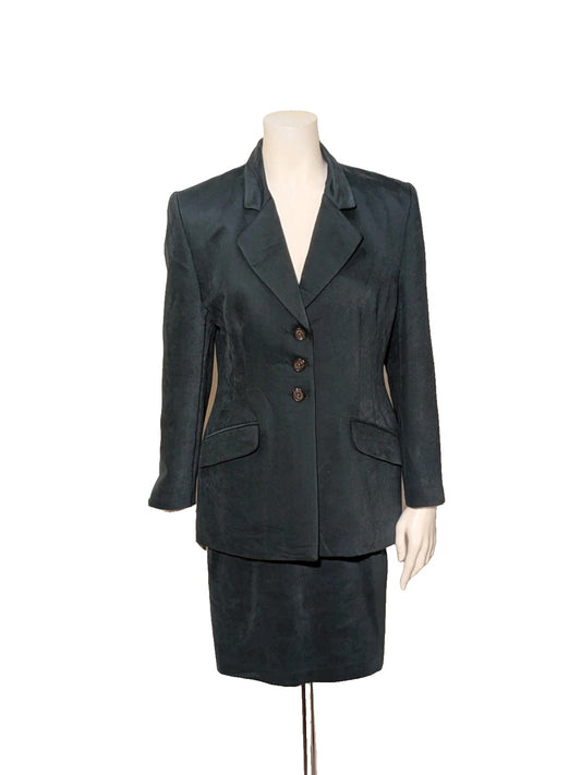 Made in Italy green skirt suit with structured jacket, three-button closure, and satin-like finish.