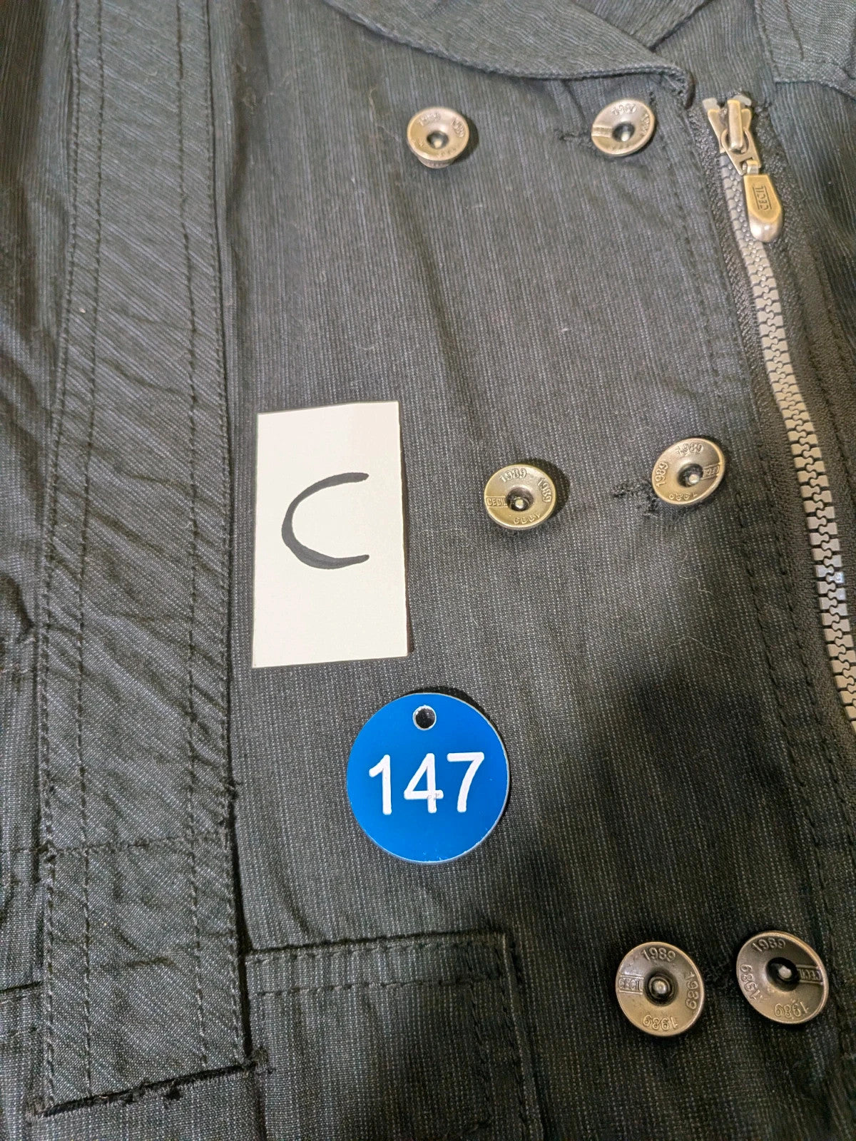 Cecil Y2K black suit with pinstripe pattern, double-breasted jacket and floral waistband pants.
