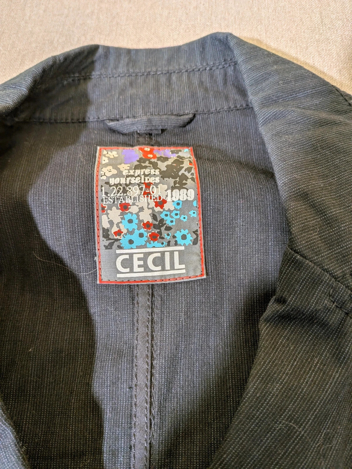 Cecil Y2K black suit with pinstripe pattern, double-breasted jacket and floral waistband pants.