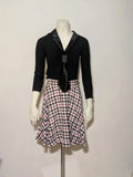 Orsay black skirt suit with houndstooth pattern and structured fabric, includes pockets.