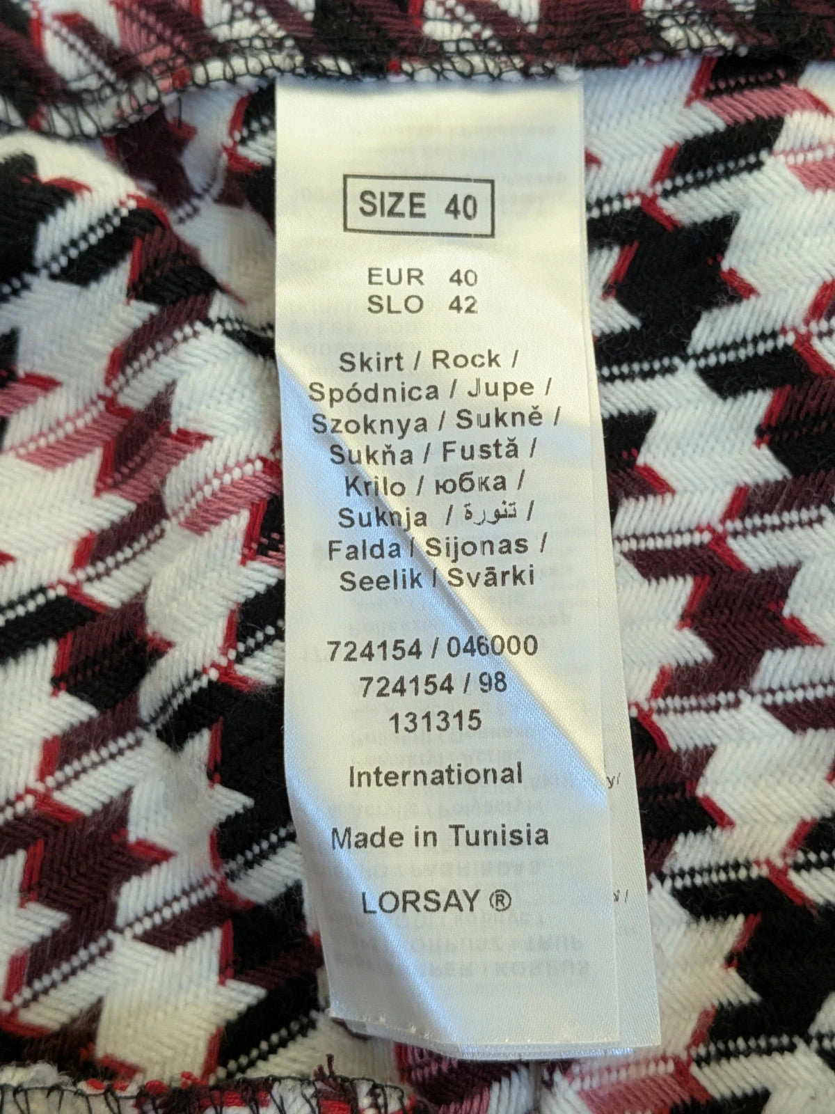 Orsay black skirt suit with houndstooth pattern and structured fabric, includes pockets.