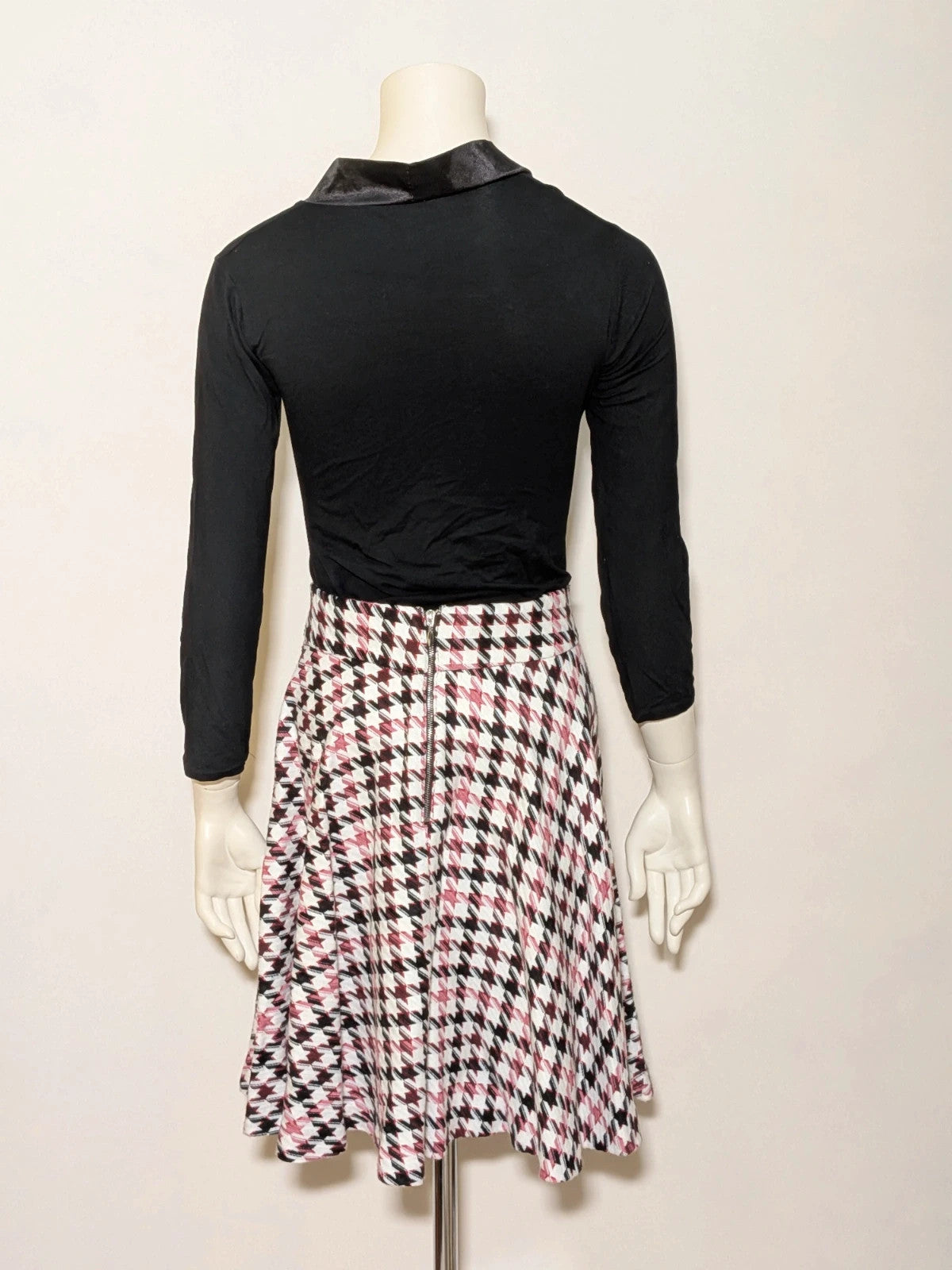 Orsay black skirt suit with houndstooth pattern and structured fabric, includes pockets.