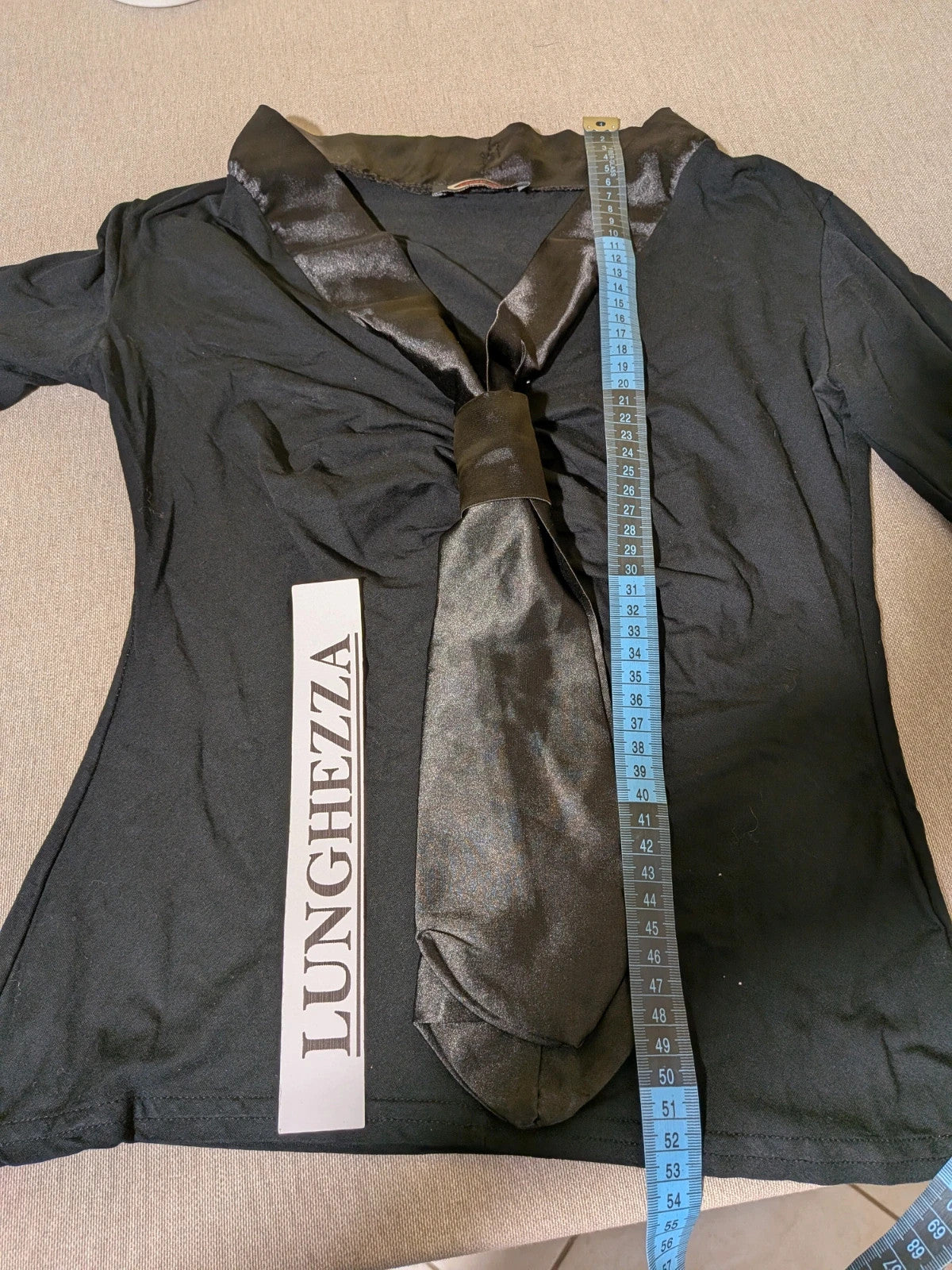 Orsay black skirt suit with houndstooth pattern and structured fabric, includes pockets.