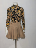 H&M floral high-neck top in beige, yellow and brown with long sleeves.
