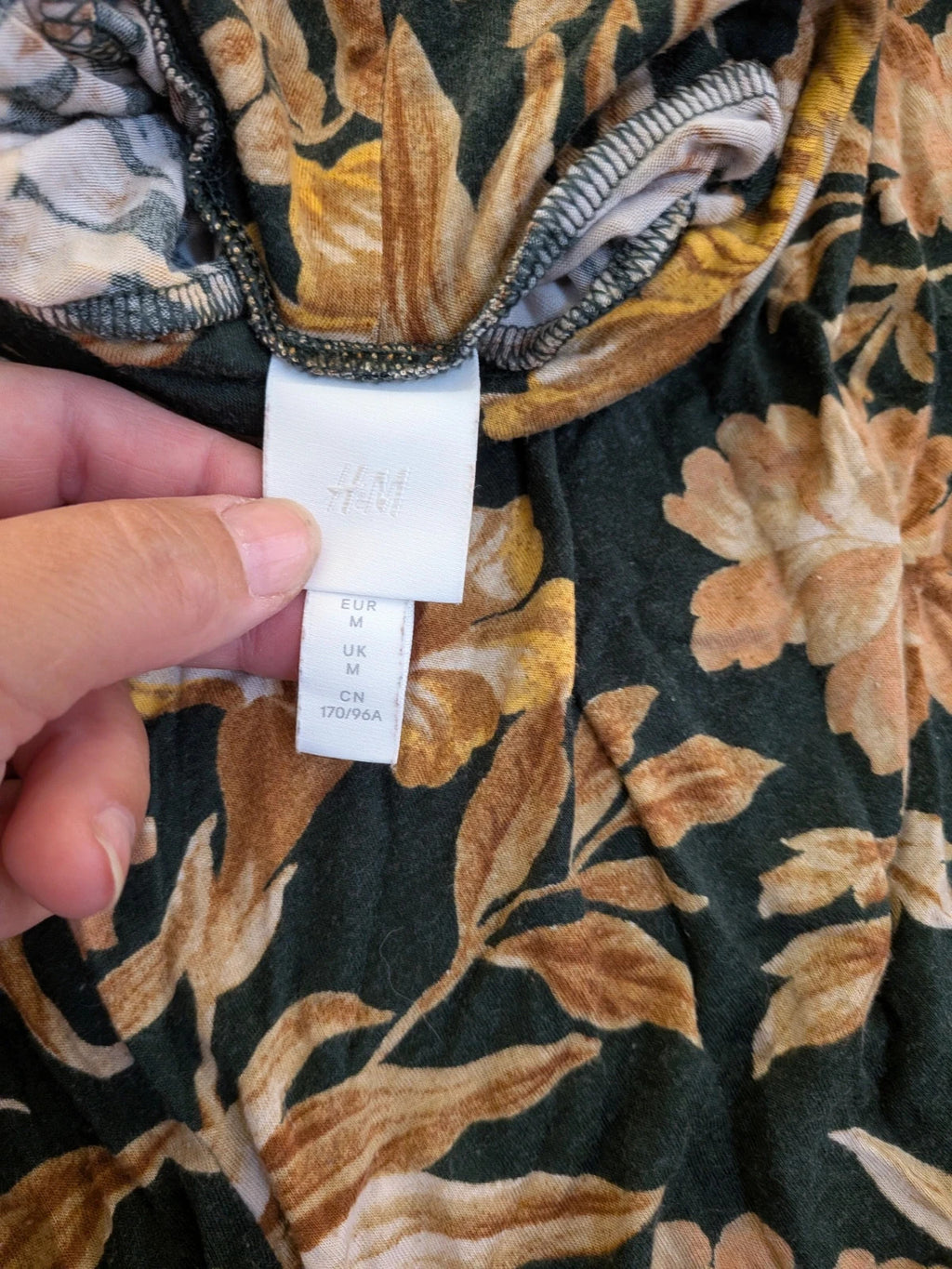 H&M floral high-neck top in beige, yellow and brown with long sleeves.