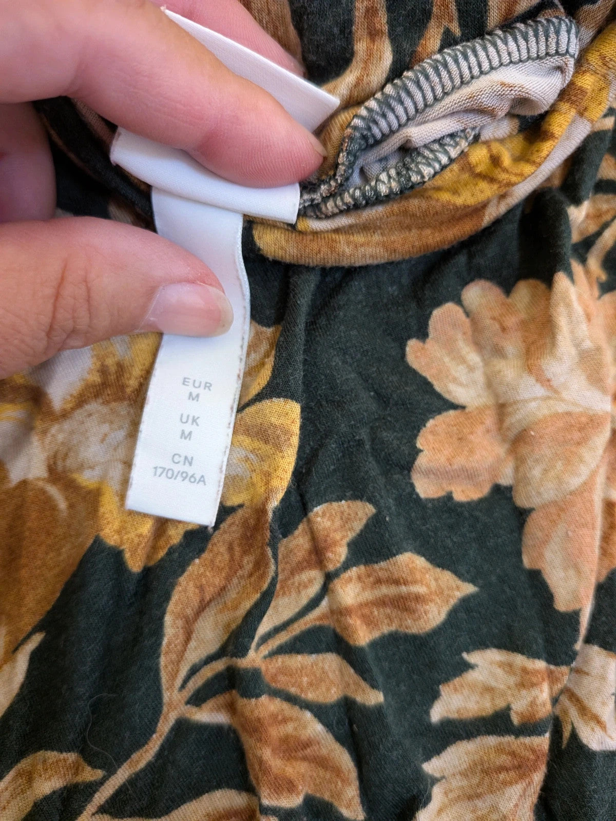 H&M floral high-neck top in beige, yellow and brown with long sleeves.