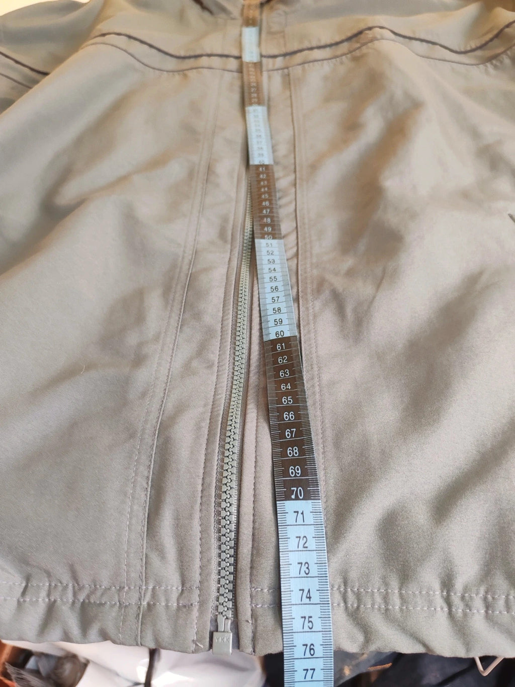 Adidas grey track jacket, high collar, zip closure, tonal details, vintage 90s style.