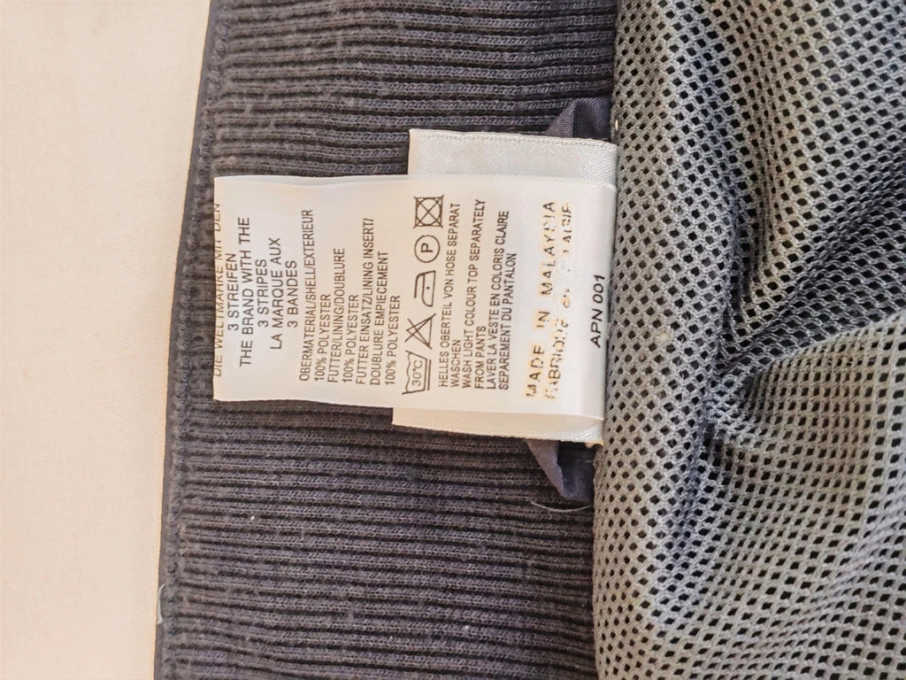 Adidas grey track jacket, high collar, zip closure, tonal details, vintage 90s style.