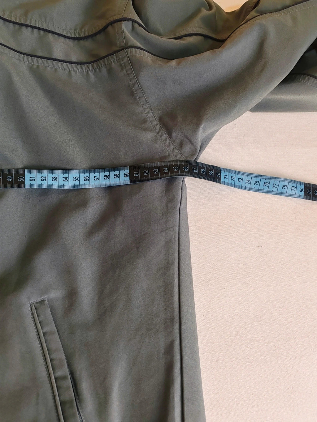 Adidas grey track jacket, high collar, zip closure, tonal details, vintage 90s style.