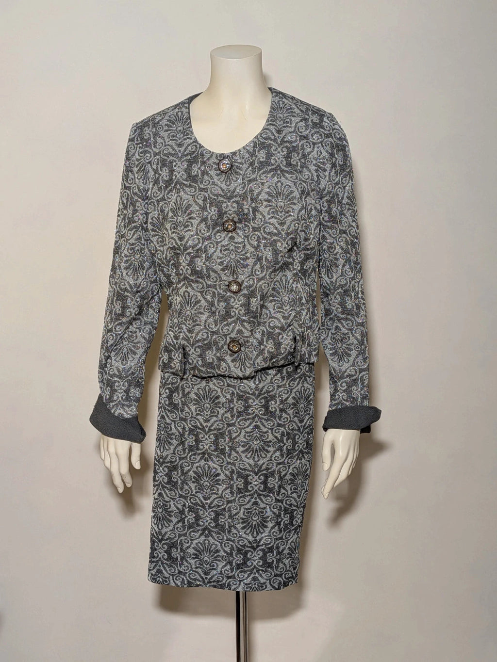 Liola grey silver skirt suit with jacquard floral pattern and short collar jacket.