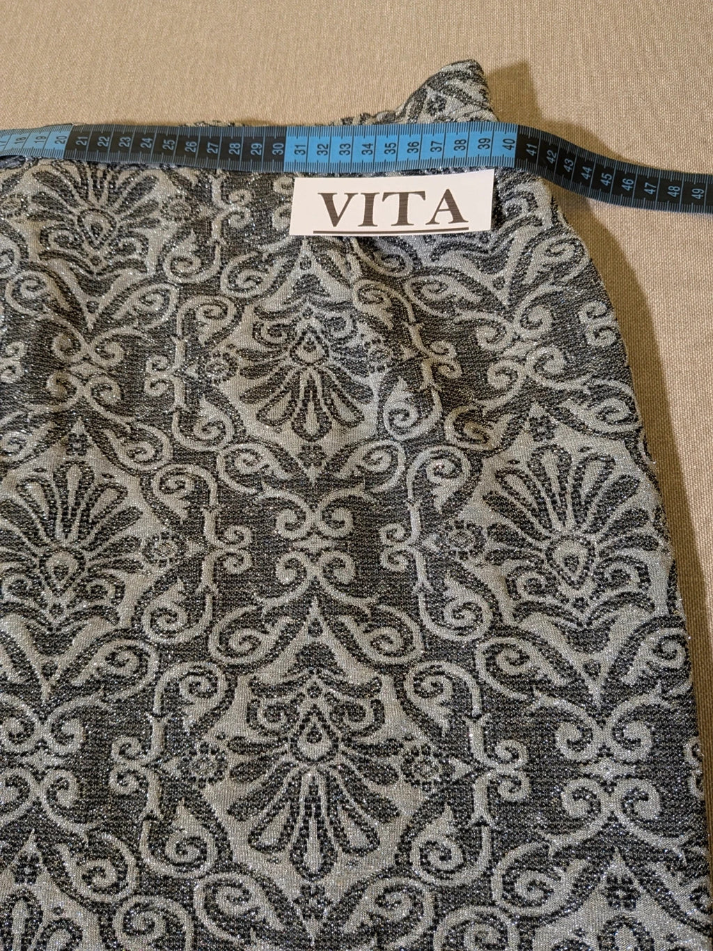 Liola grey silver skirt suit with jacquard floral pattern and short collar jacket.