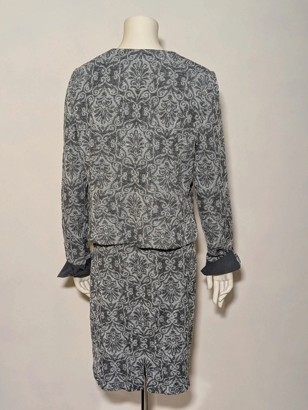 Liola grey silver skirt suit with jacquard floral pattern and short collar jacket.