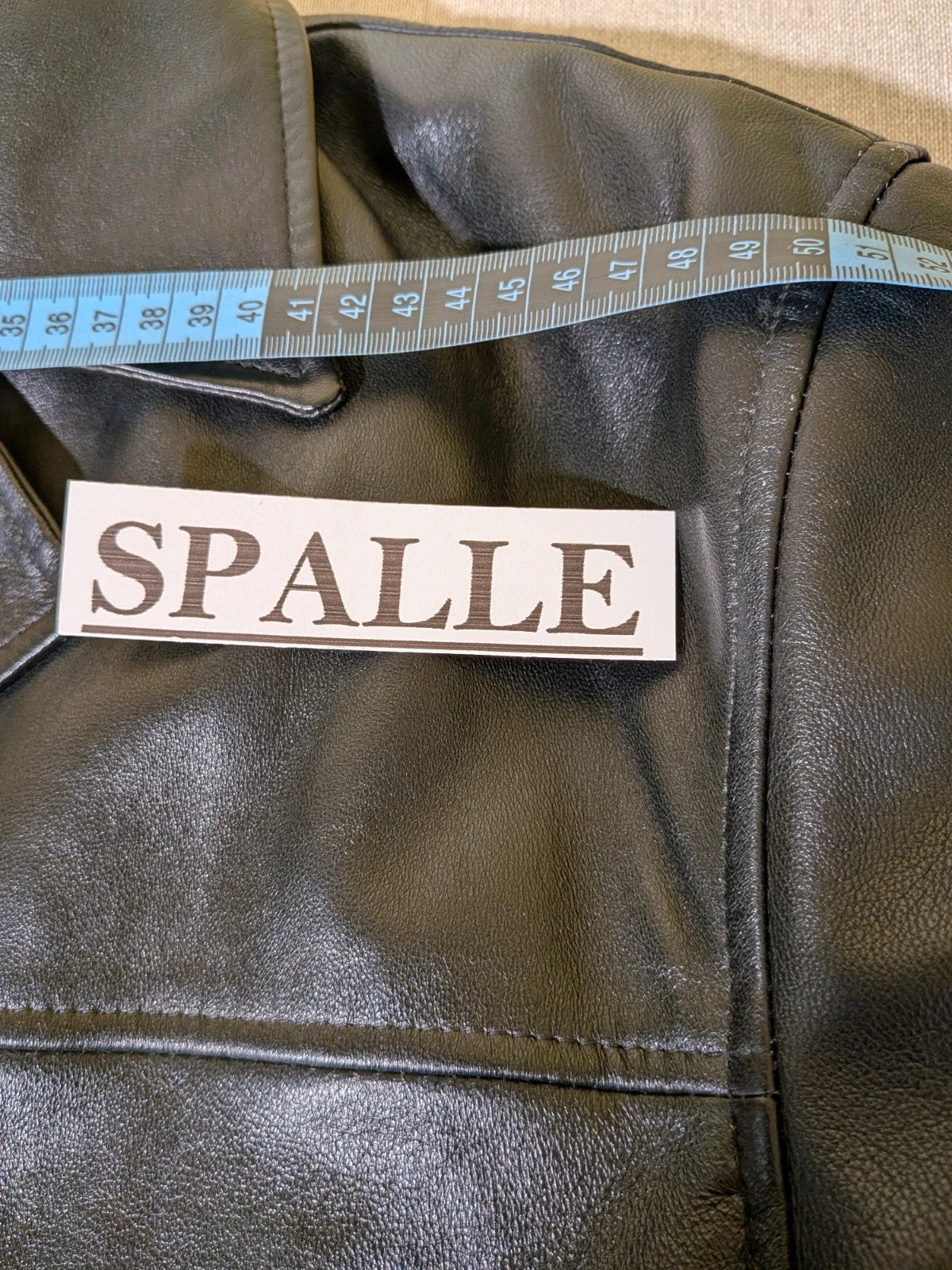 SCOUT black leather jacket vintage style with button closure and large front pockets.