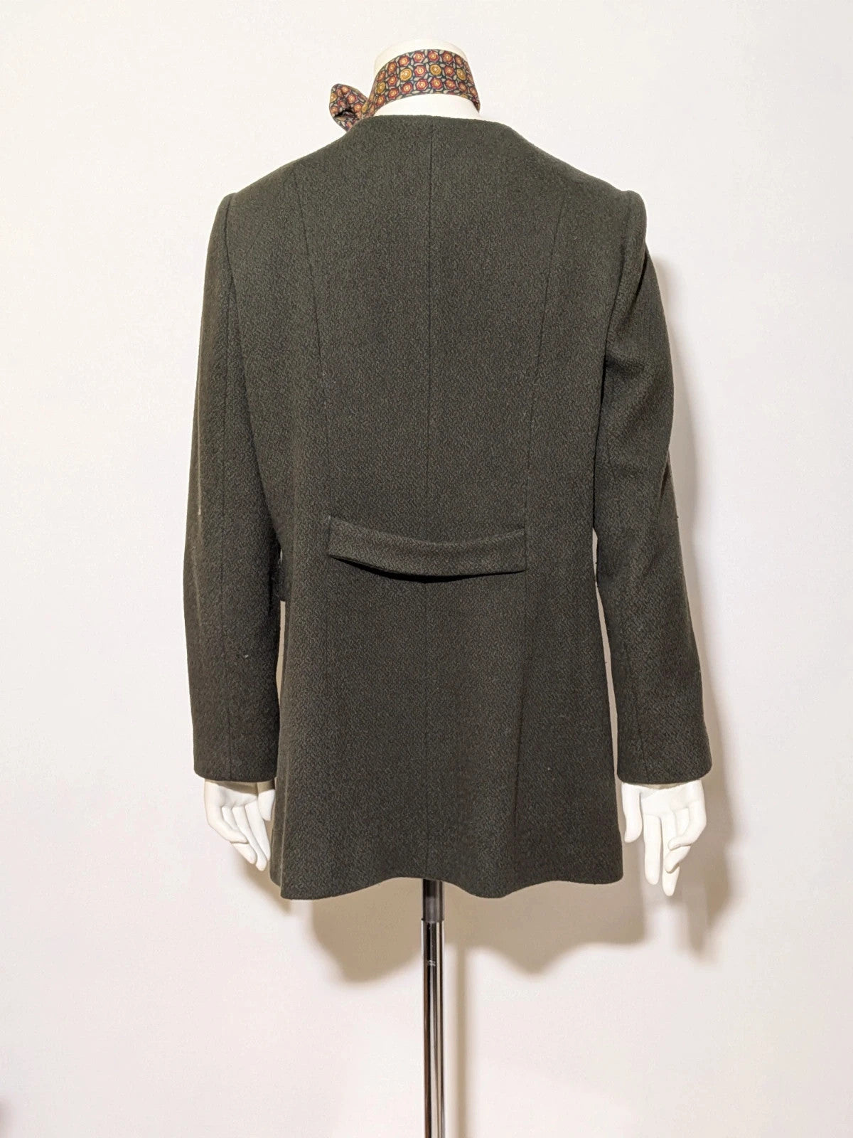 Conbipel green military coat double-breasted design with decorative flaps and covered buttons.