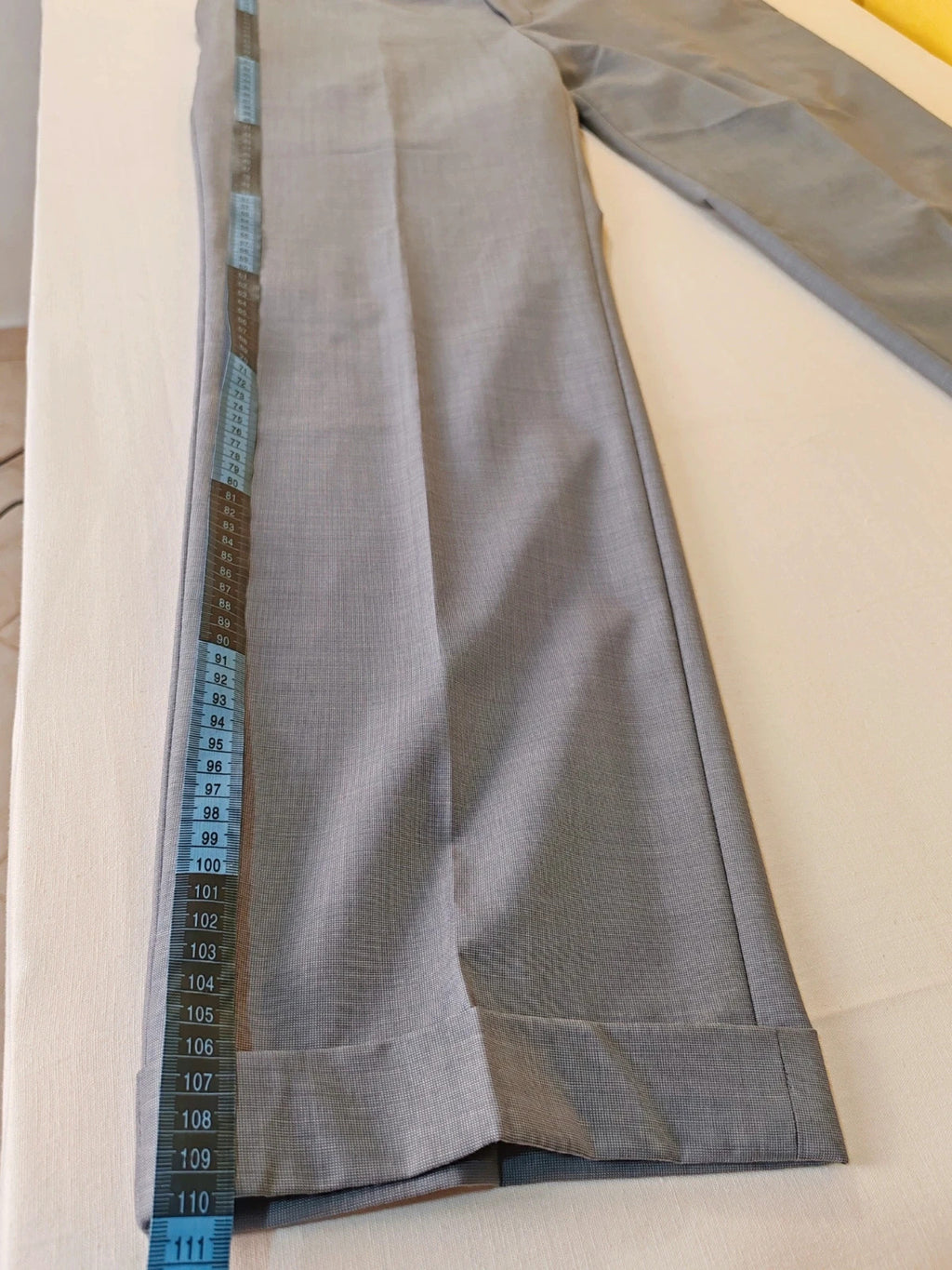 Enrico Coveri grey tailored suit with structured jacket, classic lapels, and micro-pattern.