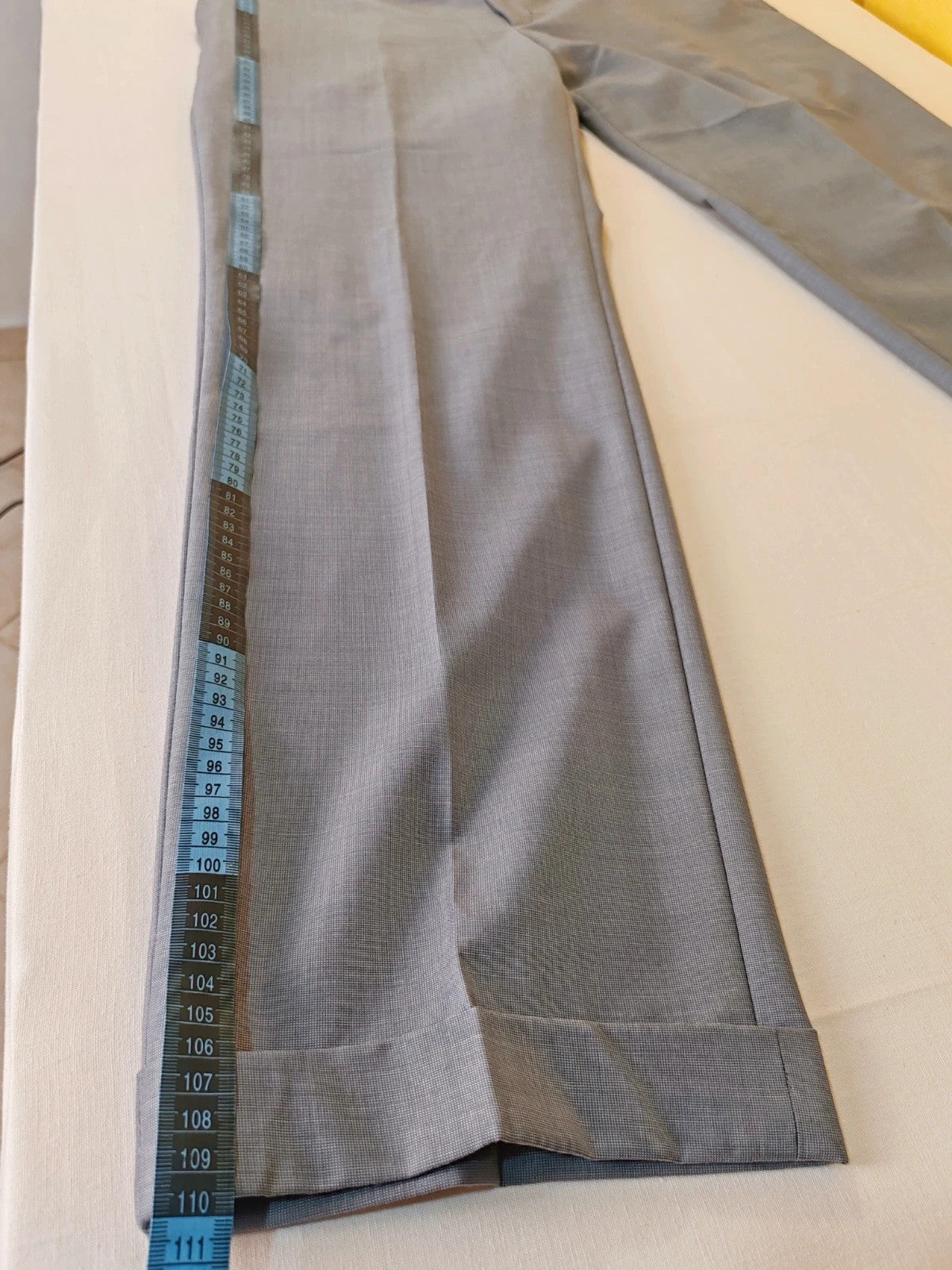 Enrico Coveri grey tailored suit with structured jacket, classic lapels, and micro-pattern.