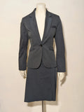 Mango Suit grey skirt suit with pinstripe pattern, single-button blazer, elegant pencil skirt.
