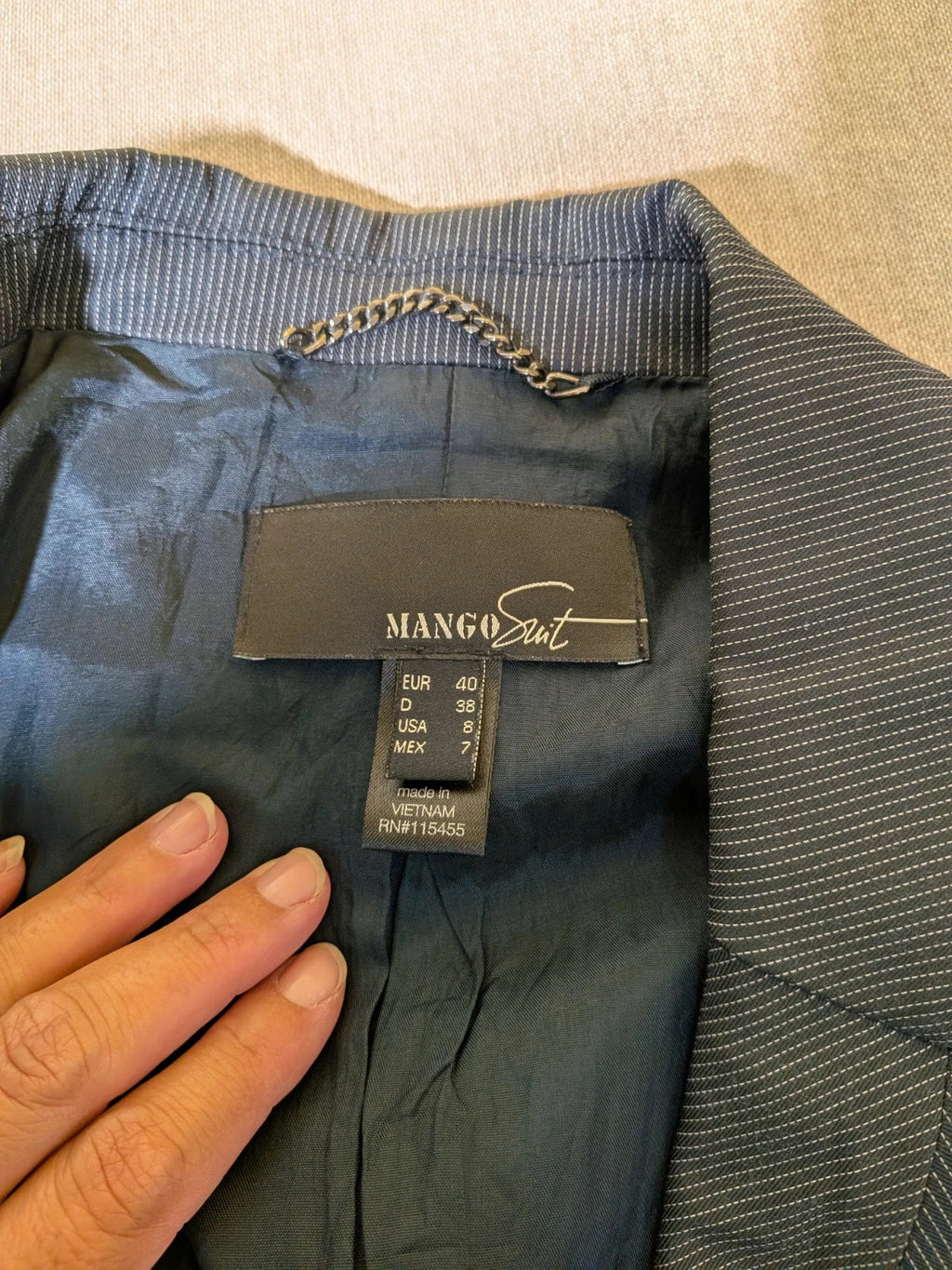 Mango Suit grey skirt suit with pinstripe pattern, single-button blazer, elegant pencil skirt.