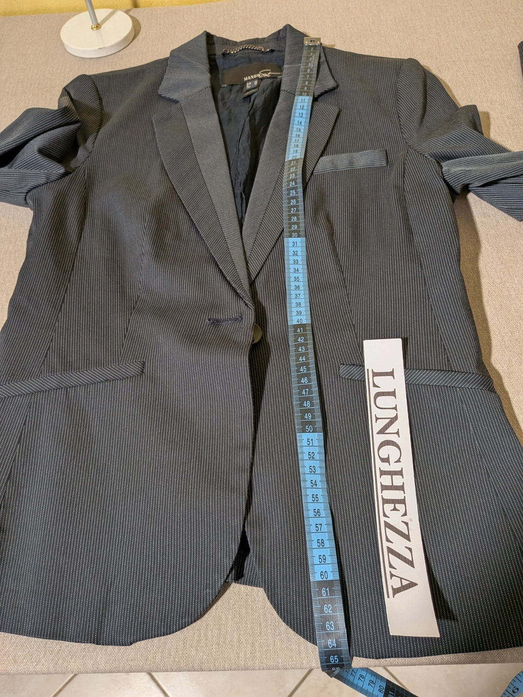 Mango Suit grey skirt suit with pinstripe pattern, single-button blazer, elegant pencil skirt.