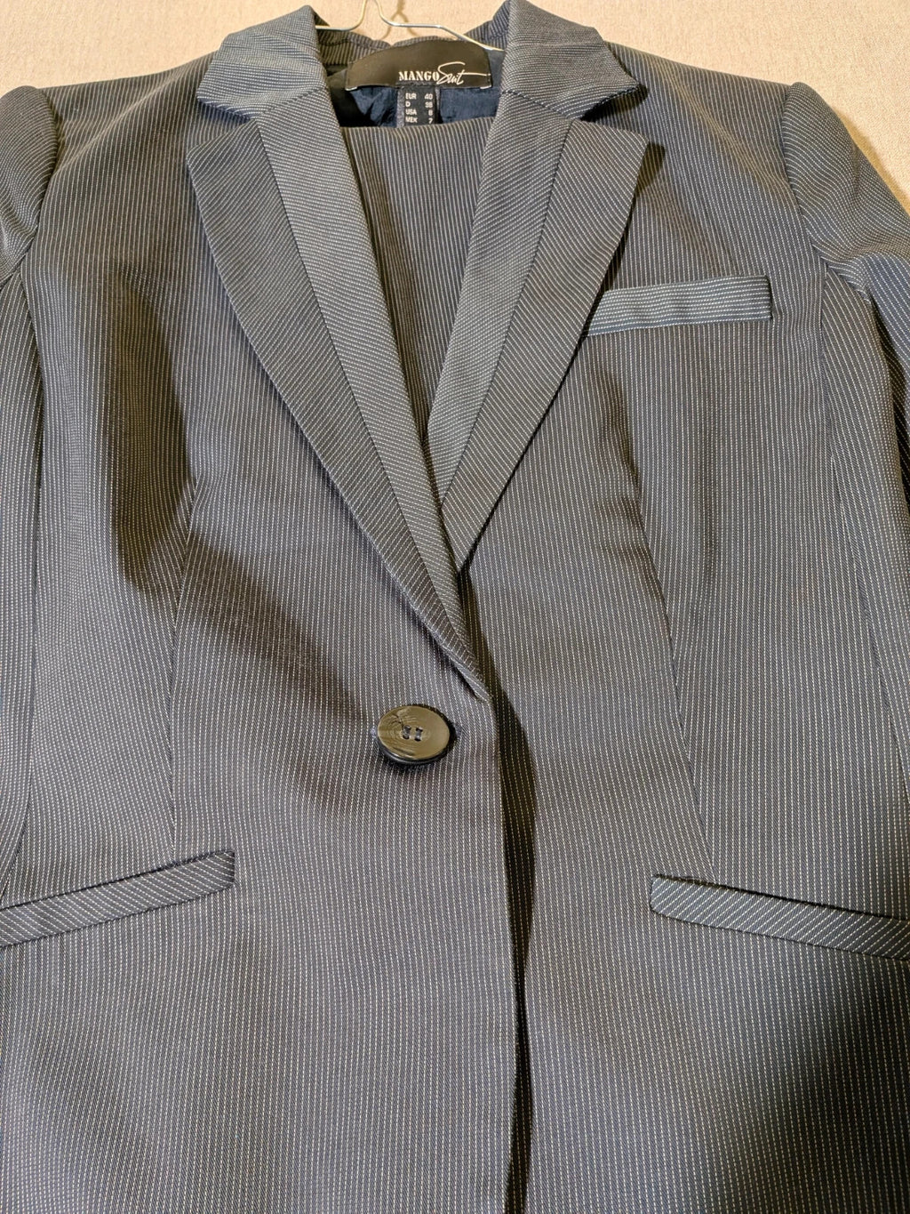 Mango Suit grey skirt suit with pinstripe pattern, single-button blazer, elegant pencil skirt.