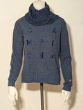 Champion navy turtleneck jumper with cable knit collar and embossed logo on front.