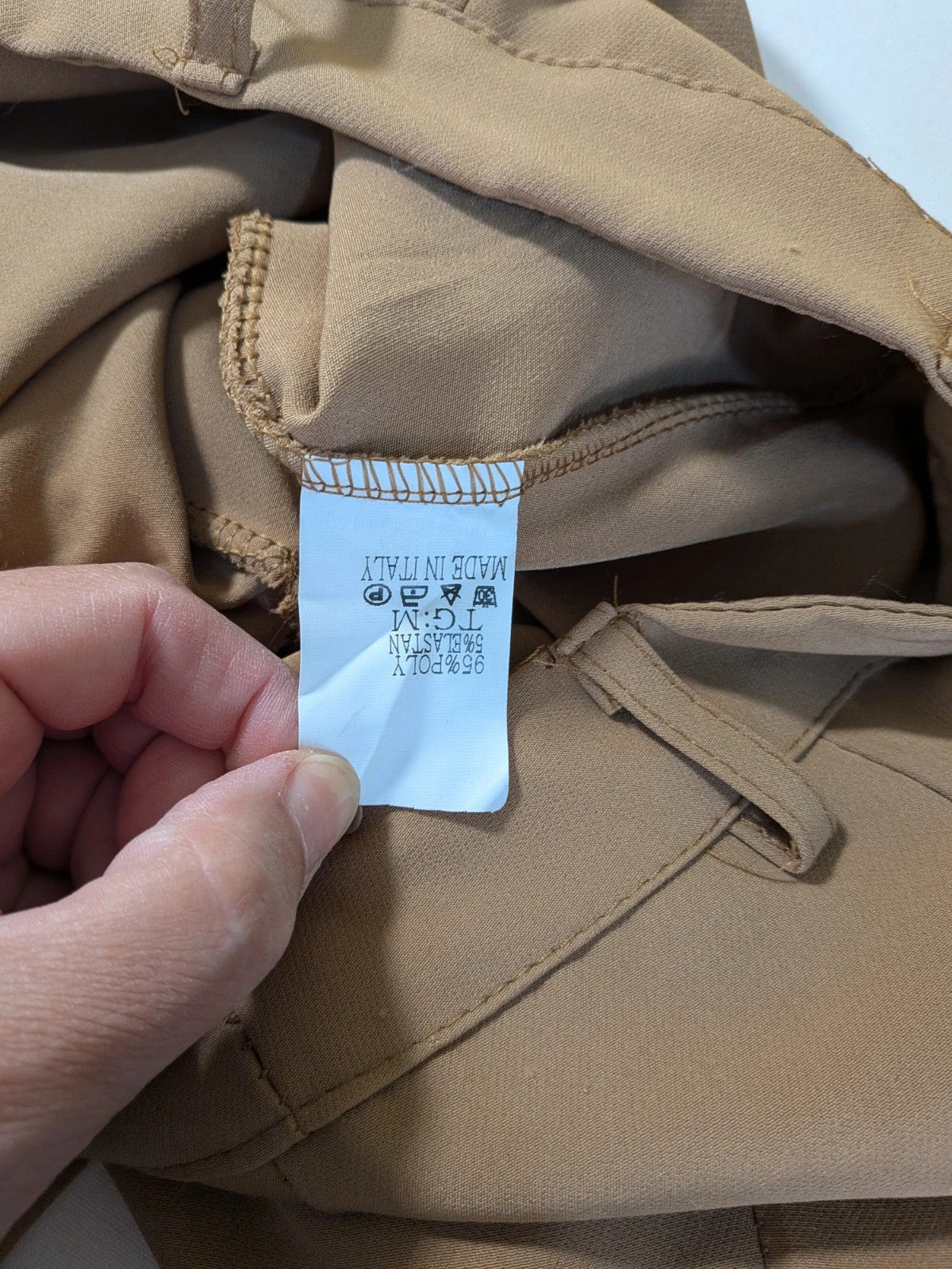 Zara Basic brown pants with flared cut, quilted jacket, gold zipper details.