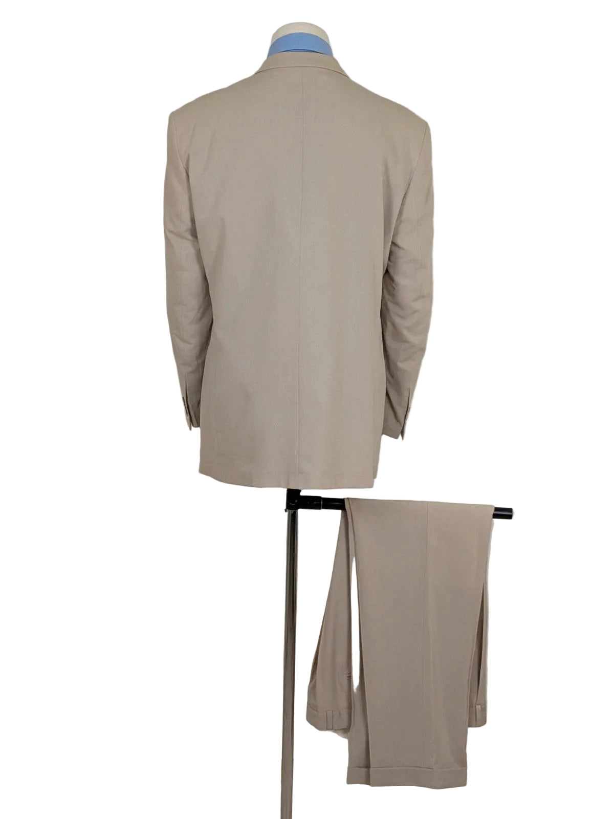 Travelmaster beige three-piece suit with classic lapel and three-button jacket design.