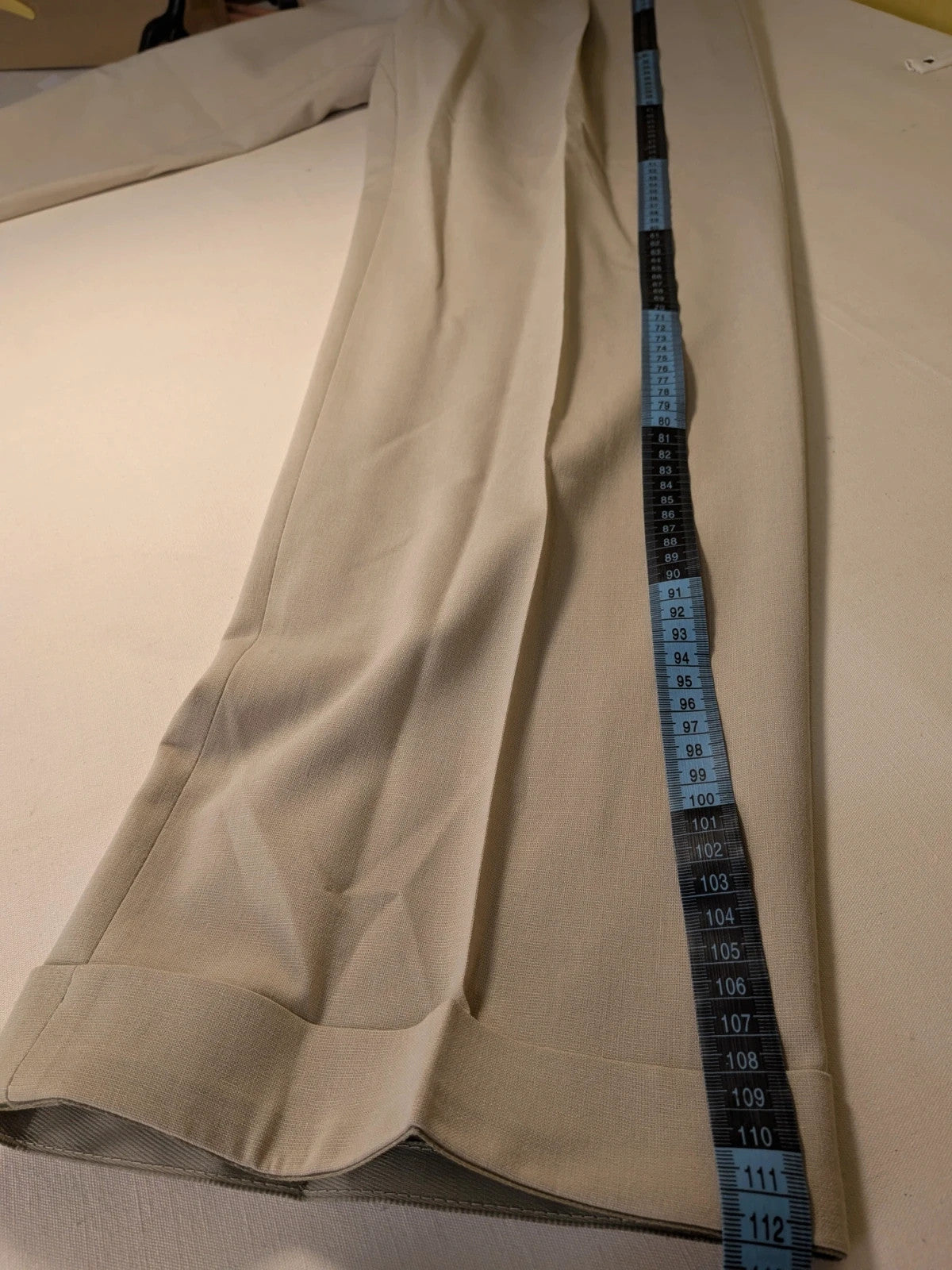 Travelmaster beige three-piece suit with classic lapel and three-button jacket design.