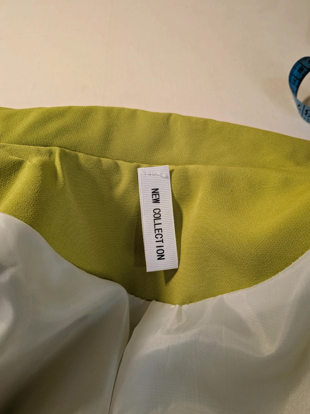 New Collection multi suit set lime green single-button blazer and straight-leg pants.
